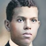 Young male in formal attire, likely early 20th century, representing HVAC innovations in a vintage studio backdrop.