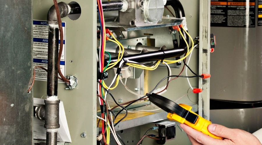 Handheld multimeter and colorful wiring for HVAC diagnostics and maintenance by Tiger Temperature, Thibodaux, LA.